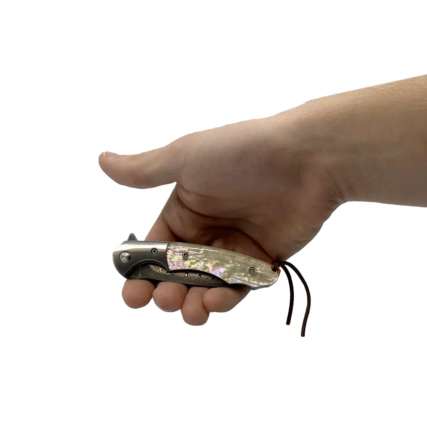 Someone holding 3.5″ Ball Bearing Folding Knife with Drop Point Damascus Blade – elegant folding knife featuring a smooth ball-bearing pivot, a 3.5″ Damascus-steel drop-point blade distinguished by visible layered patterning, an ergonomic handle (wood or abalone options), liner-lock mechanism, and pocket clip—built for seamless one-handed operation in everyday carry and collectible use, in white background.