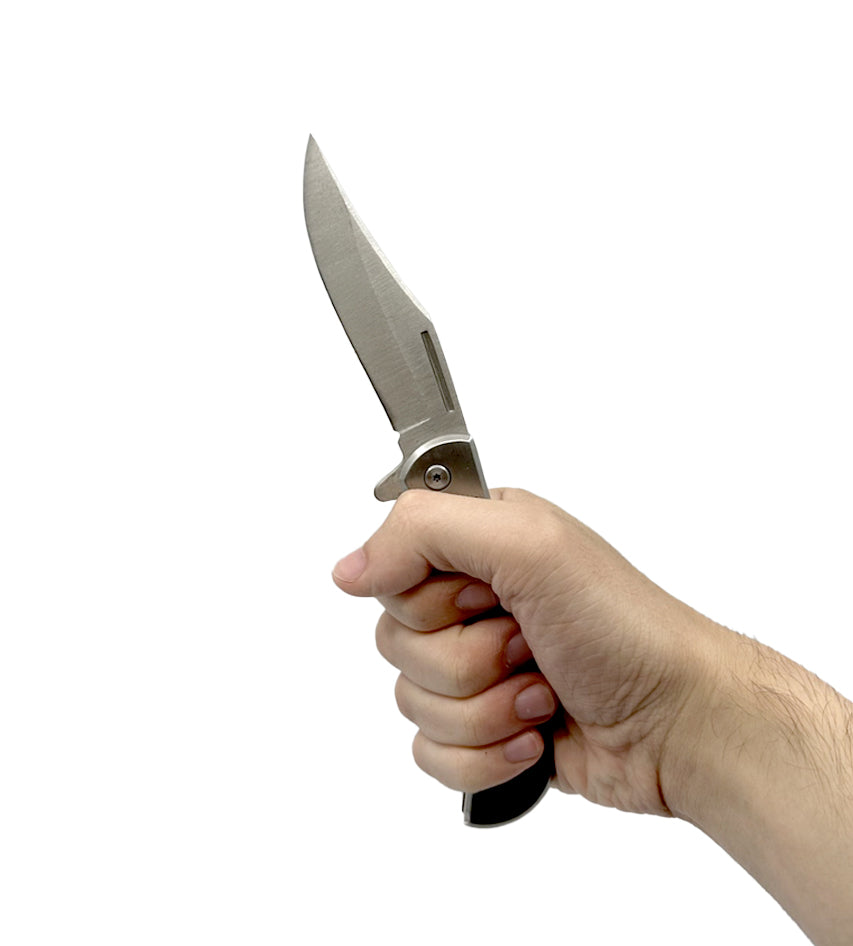 Someone holding 3.75″ Spring Assisted Folding Knife with Drop Point Blade – compact and sturdy folding knife featuring a spring-assisted opening mechanism, a sharp stainless-steel drop-point blade, and an ergonomic handle with belt clip for everyday carry and utility, in white background.