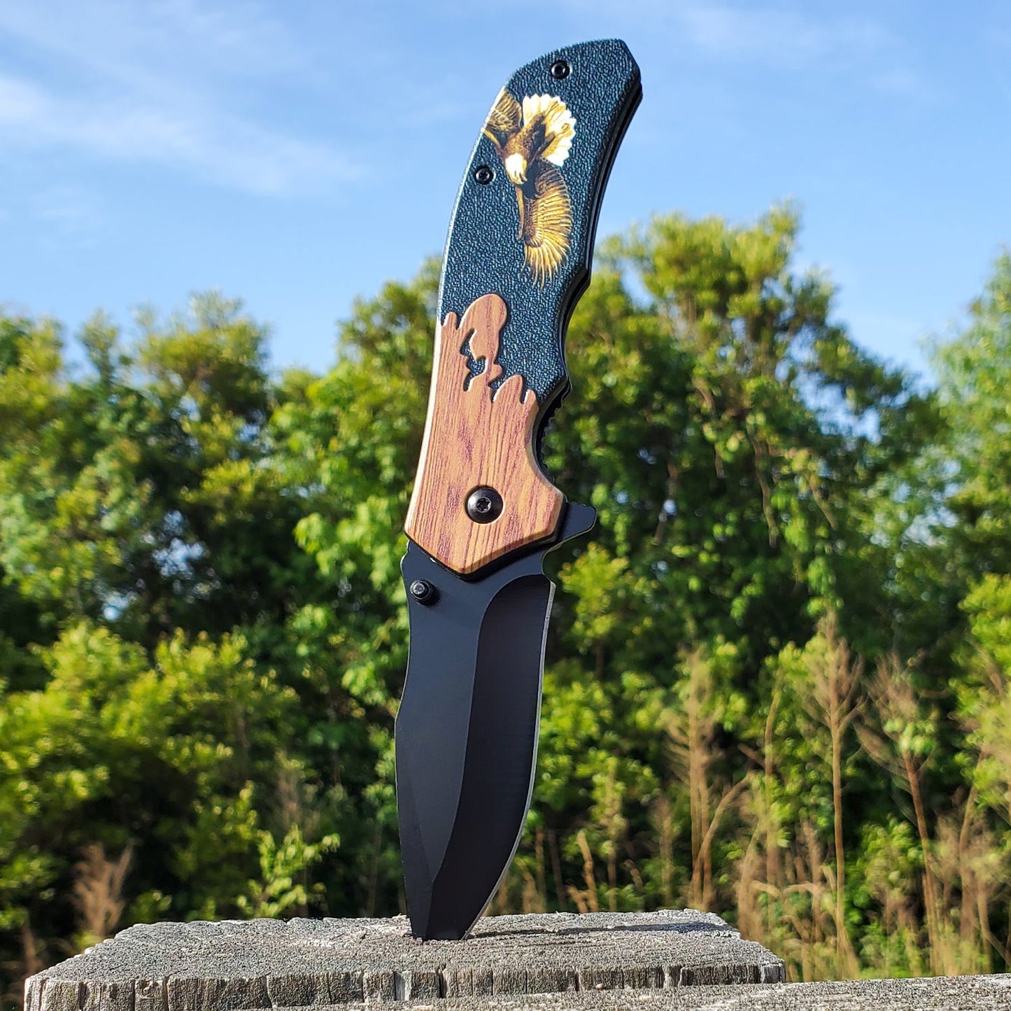8-Inch Wildlife Folding Knife – classic spring-assisted folding knife featuring a 3.25" 420C stainless steel blade and wildlife-themed handle, designed for everyday carry and outdoor use, stabbed into wood, in sunny nature background.