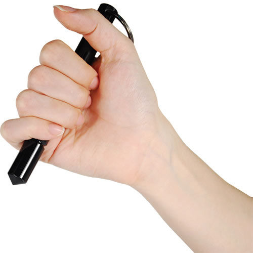 Close-up of someone holding a 5.5" aircraft grade aluminum kubotan keychain placed on a white background.