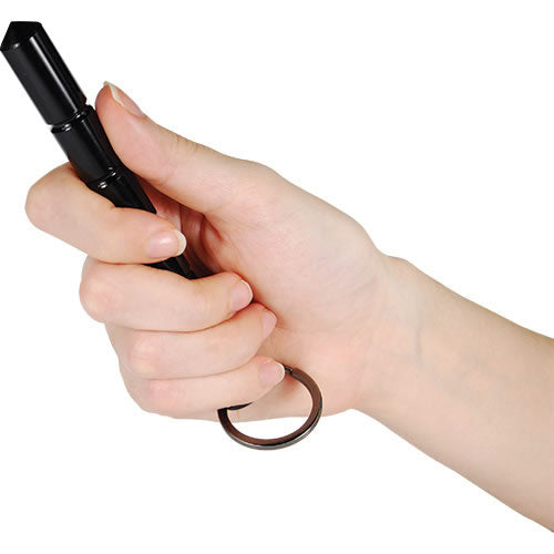 Close-up of someone holding a 5.5" aircraft grade aluminum kubotan keychain placed on a white background.