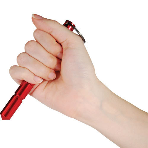 Close-up of someone holding a 5.5" aircraft grade aluminum kubotan keychain placed on a white background.