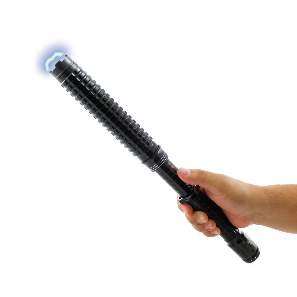 Someone holding an Attitude Adjuster 30,000,000 stun baton flashlight with textured grip and built-in LED light on white background.