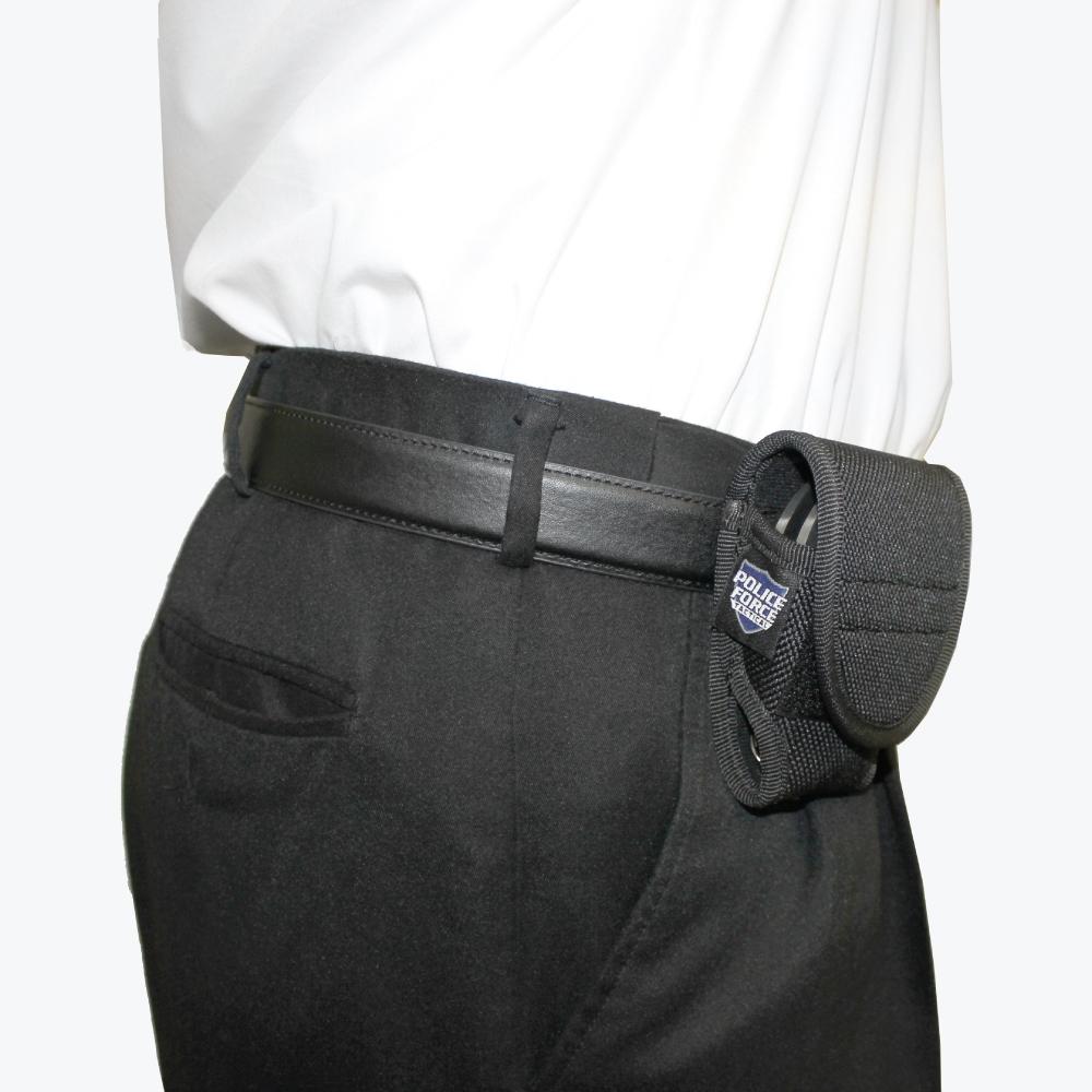Someone carrying Handcuff Holster - secure and durable pouch designed to hold standard handcuffs, ideal for law enforcement and tactical use, in white background.
