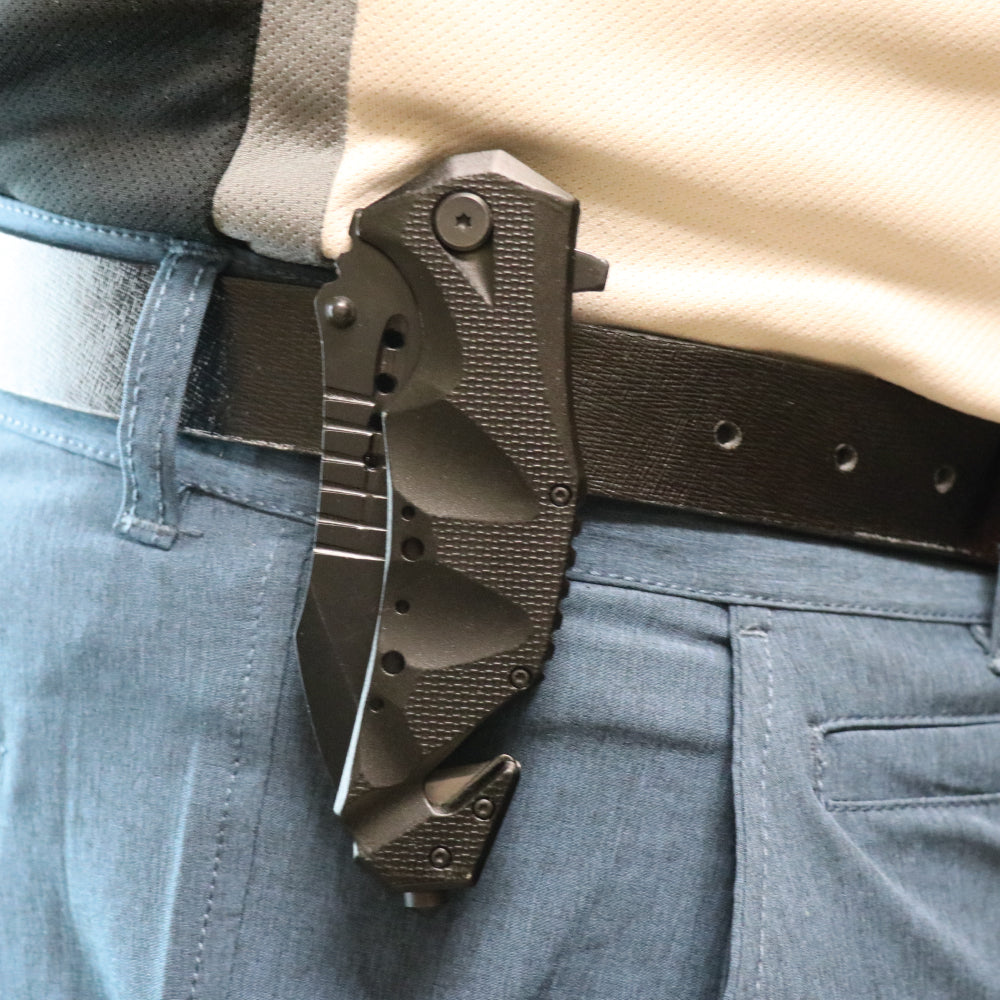 Someone carrying Military Grade 9" Tactical Rescue Knife - heavy-duty folding knife featuring a seatbelt cutter and glass breaker, built for tough emergency and tactical situations.