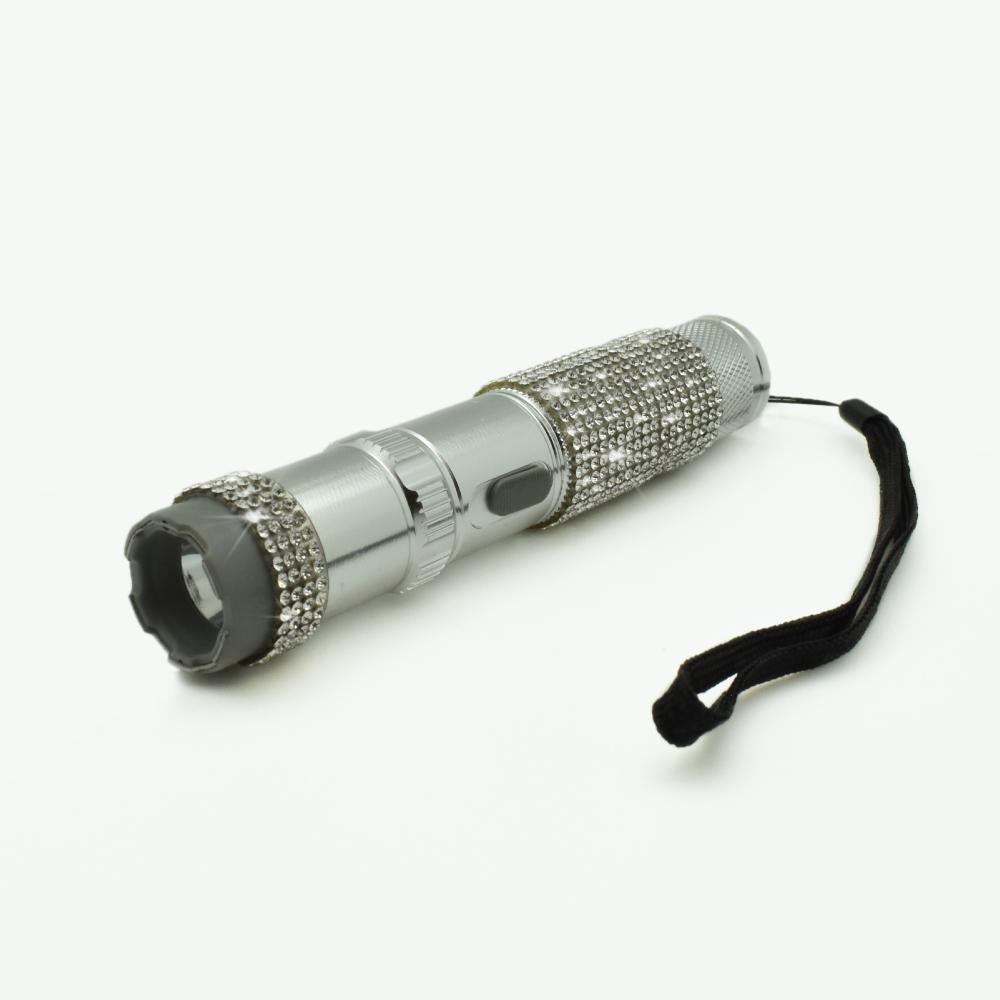 Rhinestun 75,000,000 Stun Flashlight - stylish and powerful self-defense flashlight featuring rhinestone accents and a high-volage stun gun for discreet personal protection, in white background.
