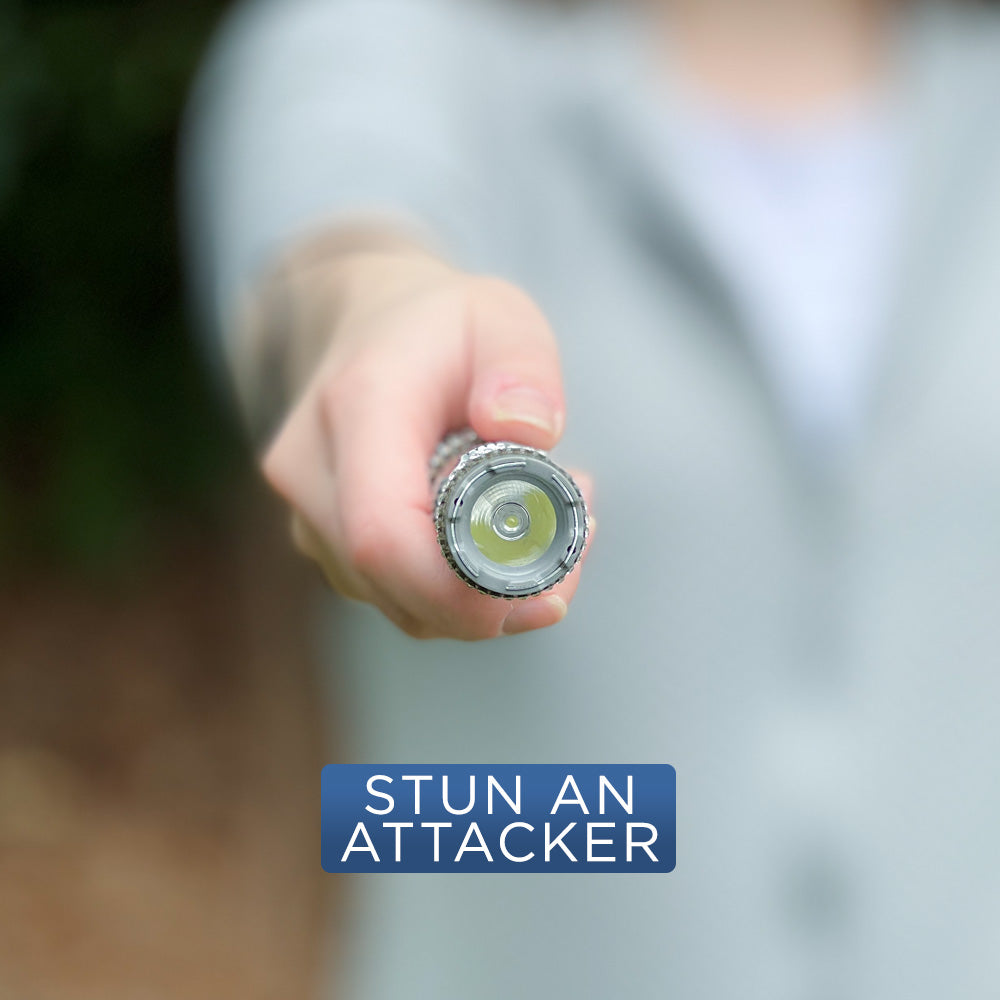 Close-up of someone holding Rhinestun 75,000,000 Stun Flashlight - stylish and powerful self-defense flashlight featuring rhinestone accents and a high-volage stun gun for discreet personal protection.