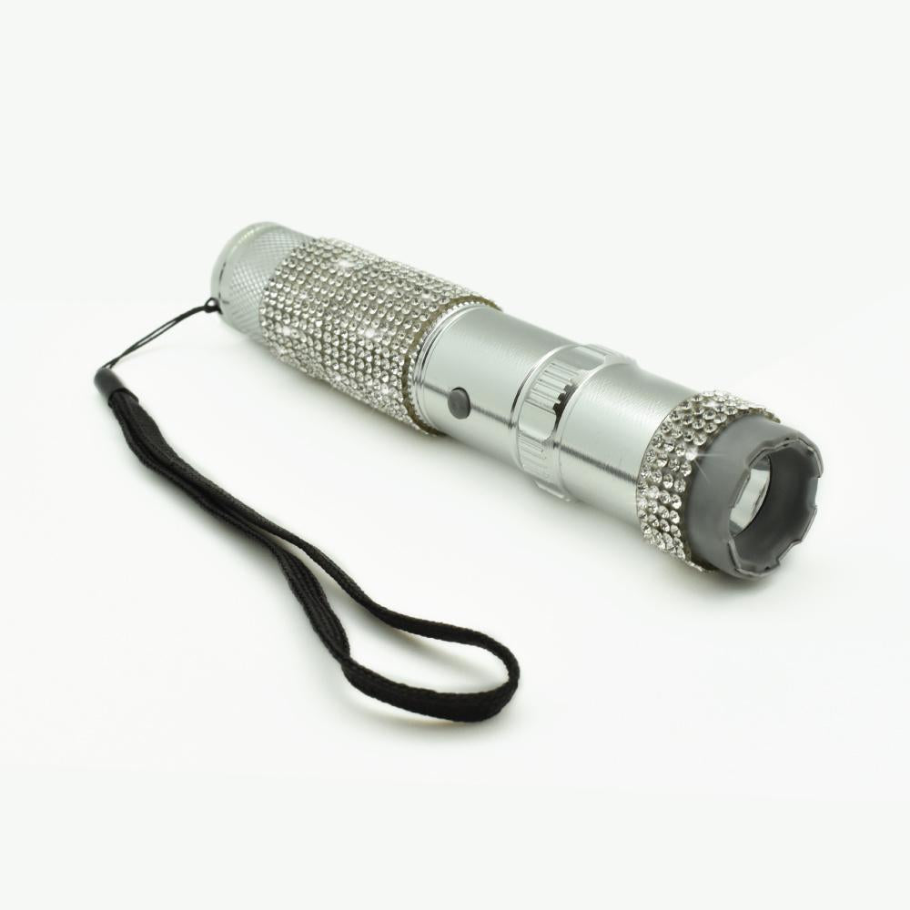 Rhinestun 75,000,000 Stun Flashlight - stylish and powerful self-defense flashlight featuring rhinestone accents and a high-volage stun gun for discreet personal protection, in white background.