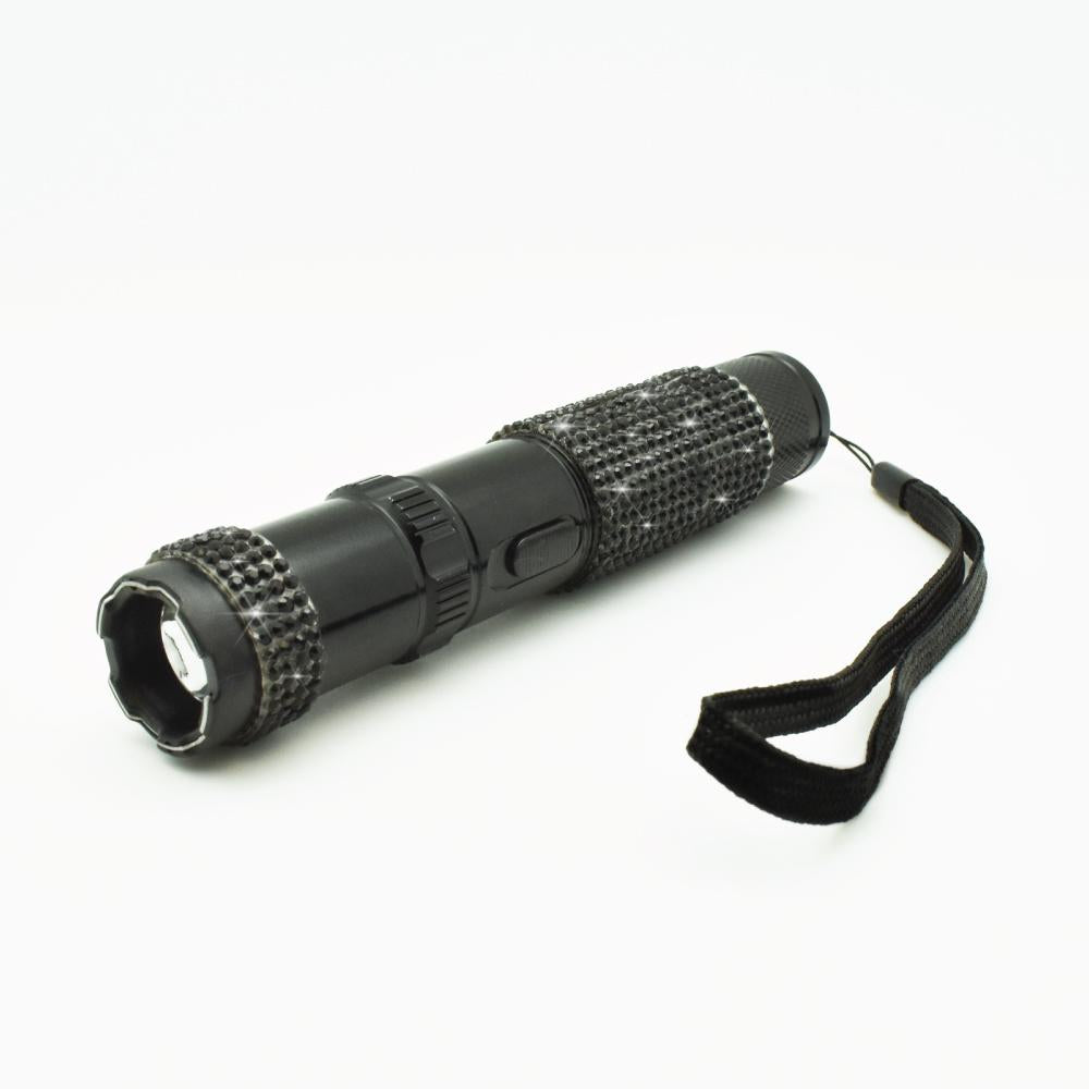 Rhinestun 75,000,000 Stun Flashlight - stylish and powerful self-defense flashlight featuring rhinestone accents and a high-volage stun gun for discreet personal protection, in white background.