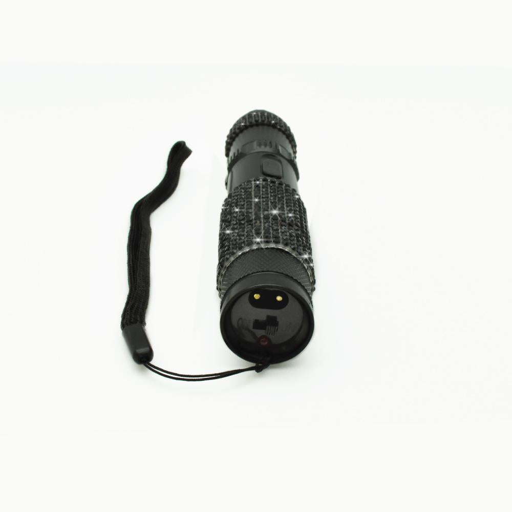 Rhinestun 75,000,000 Stun Flashlight - stylish and powerful self-defense flashlight featuring rhinestone accents and a high-volage stun gun for discreet personal protection, in white background.