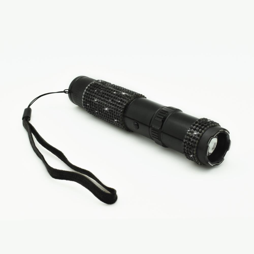 Rhinestun 75,000,000 Stun Flashlight - stylish and powerful self-defense flashlight featuring rhinestone accents and a high-volage stun gun for discreet personal protection, in white background.