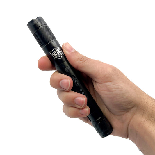 Someone holding Streetlight Stun Gun 84,000,000 – high-voltage stun gun disguised as a streetlight-style flashlight, combining powerful self-defense capability with practical illumination for everyday protection, in white background.