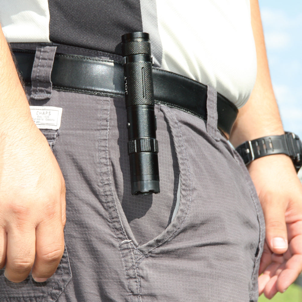 Someone carrying Tactical 75,000,000 Stun Flashlight - extremely powerful self-defense flashlight with high-voltage stun capability, designed for tactical reliability and protection.