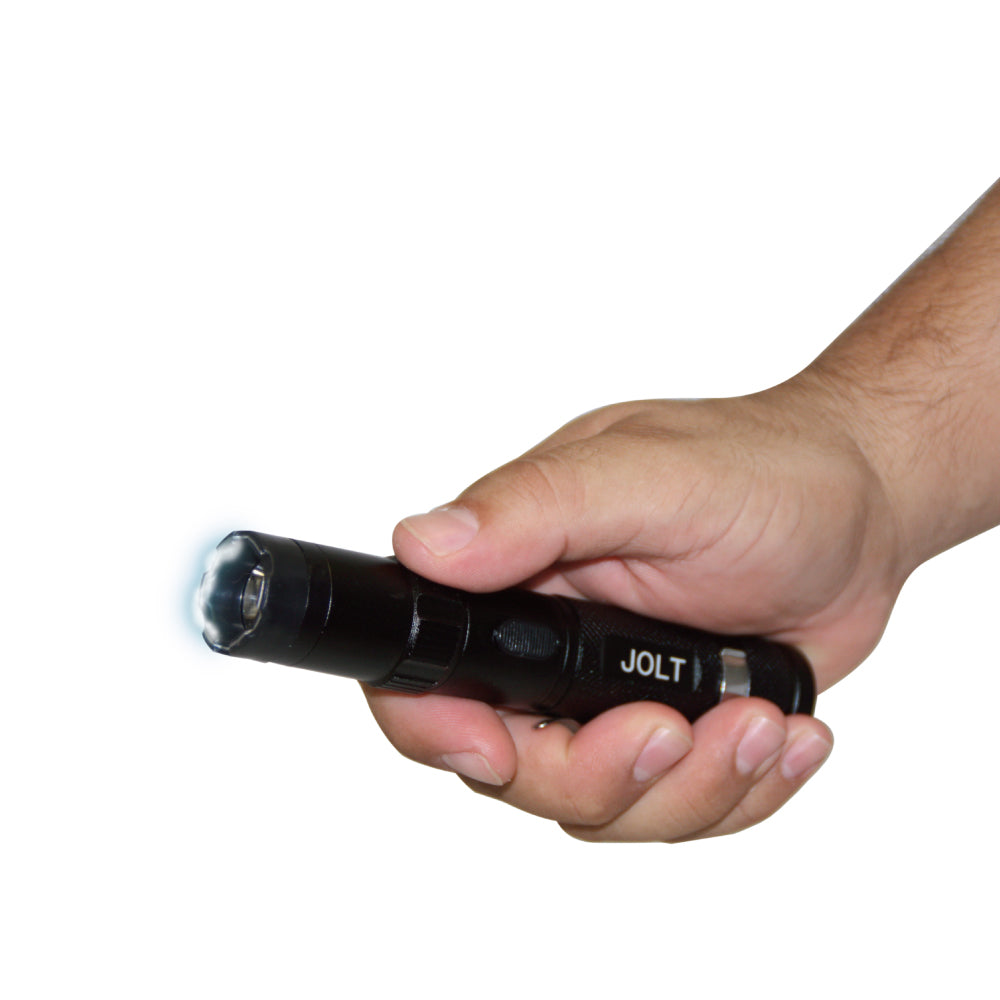 Someone holding Tactical 75,000,000 Stun Flashlight - extremely powerful self-defense flashlight with high-voltage stun capability, designed for tactical reliability and protection, in white background.