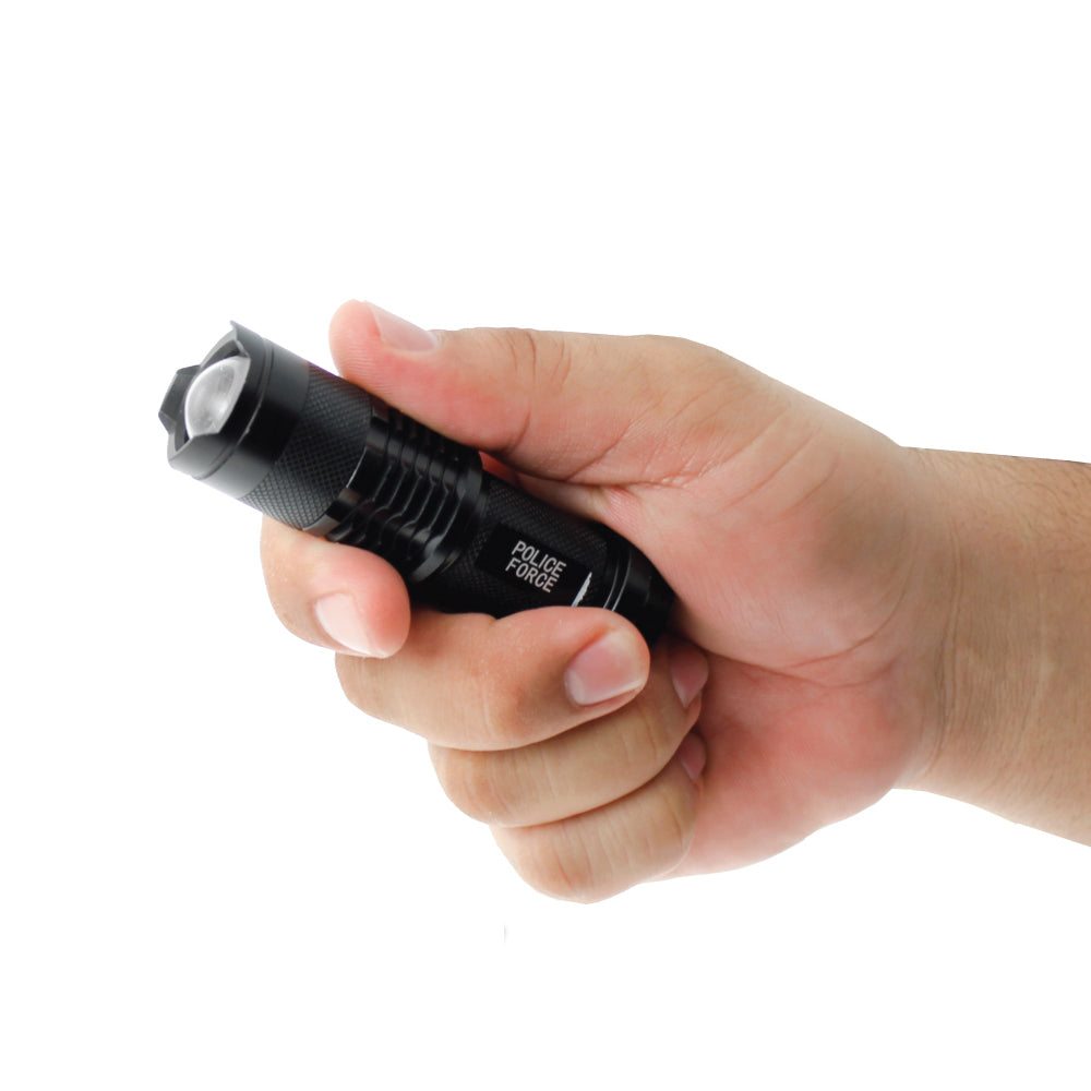 Someone holding Tactical Q5 LED Flashlight – compact and powerful flashlight featuring a Q5 LED for high brightness and reliable performance in tactical situations, in white background.