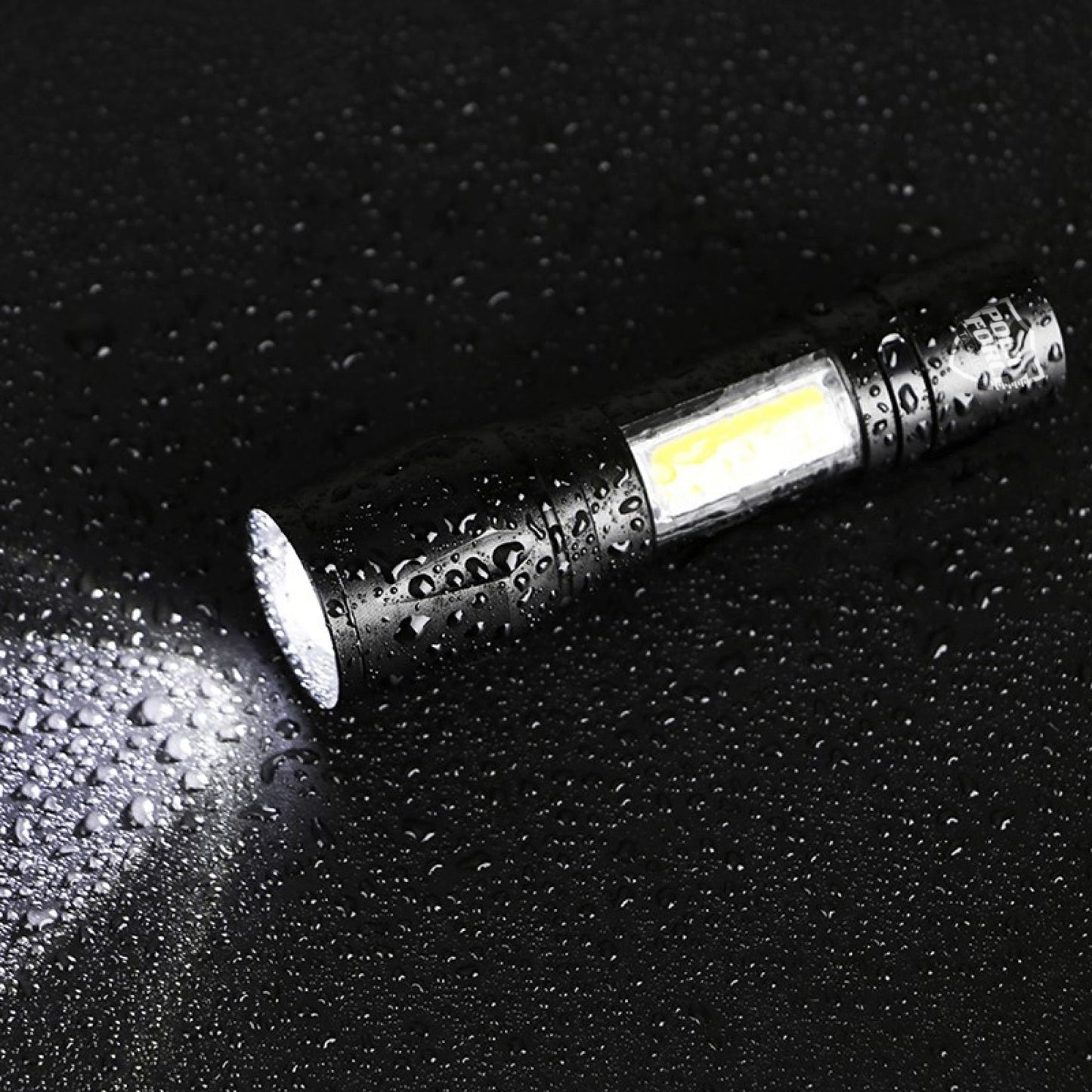 Tactical XPE/COB Mini Flashlight – compact flashlight featuring dual XPE and COB LED technology for versatile and powerful lighting in a small form factor, covered in rain drops, in dark background.