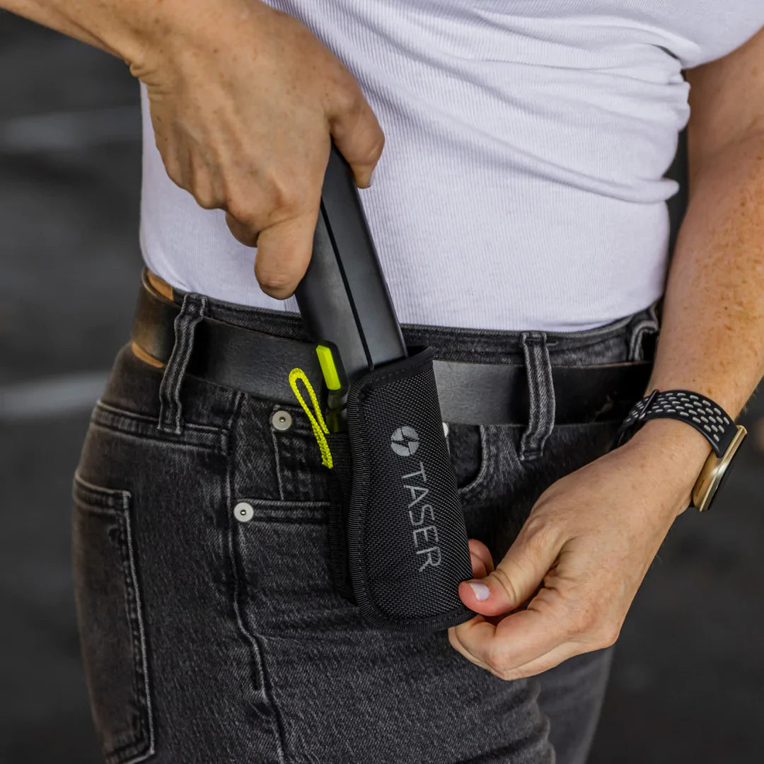 Someone carrying TASER StrikeLight 2 Kit – versatile self-defense flashlight featuring a 700-lumen beam, built-in stun capability, audible arc warning, and USB-C charging for everyday protection.