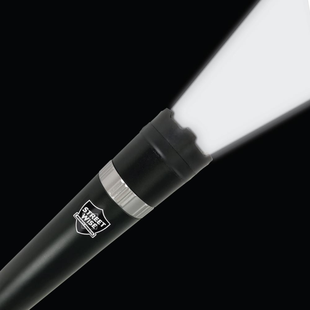 Triple Defender 27,000,000* Stun Baton Flashlight with integrated light and rubberized grip, ideal for personal security and law enforcement use.
