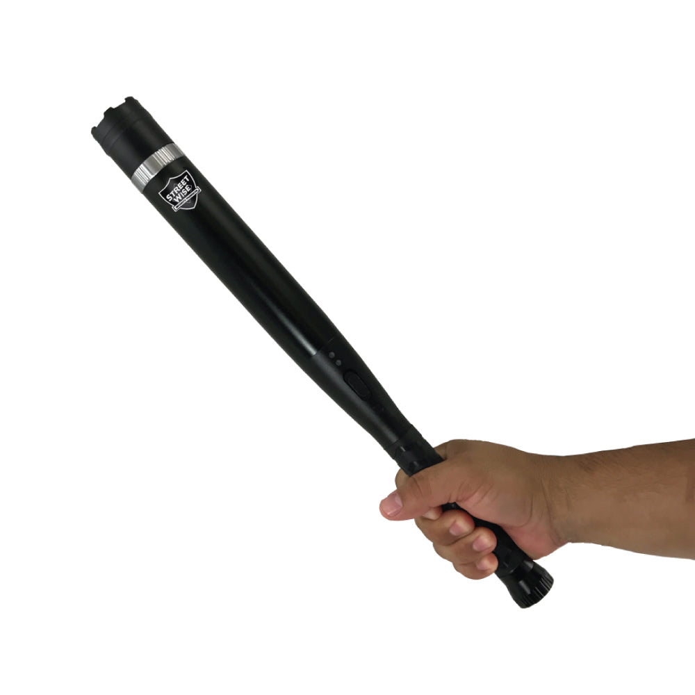Triple Defender 27,000,000* Stun Baton Flashlight with integrated light and rubberized grip, ideal for personal security and law enforcement use.