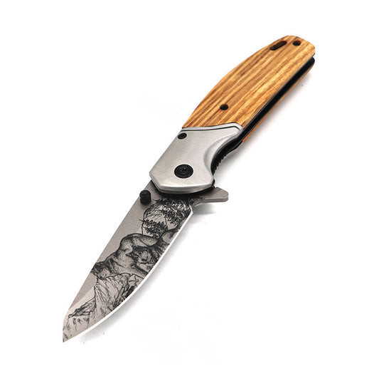 3.5″ Spring Assisted Folding Knife with Drop Point Blade – features a 3.5″ stainless steel drop point blade with decorative 3D‑printed wolf design, spring‑assist opening, ergonomic stainless steel and wood‑overlay handle (4.5″ closed), and pocket clip for everyday carry and tactical use, in white background.
