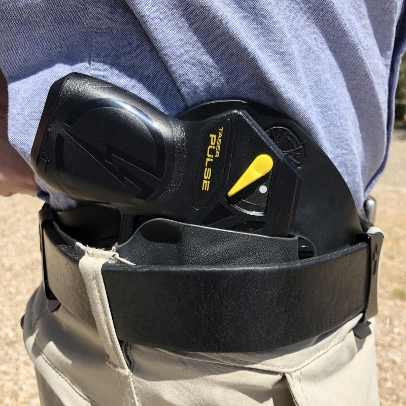 Someone carrying Appendix Carry Right-handed Holster - minimalist inside-the-waistband holster designed for comfortable and secure appendix carry for right-handed users.