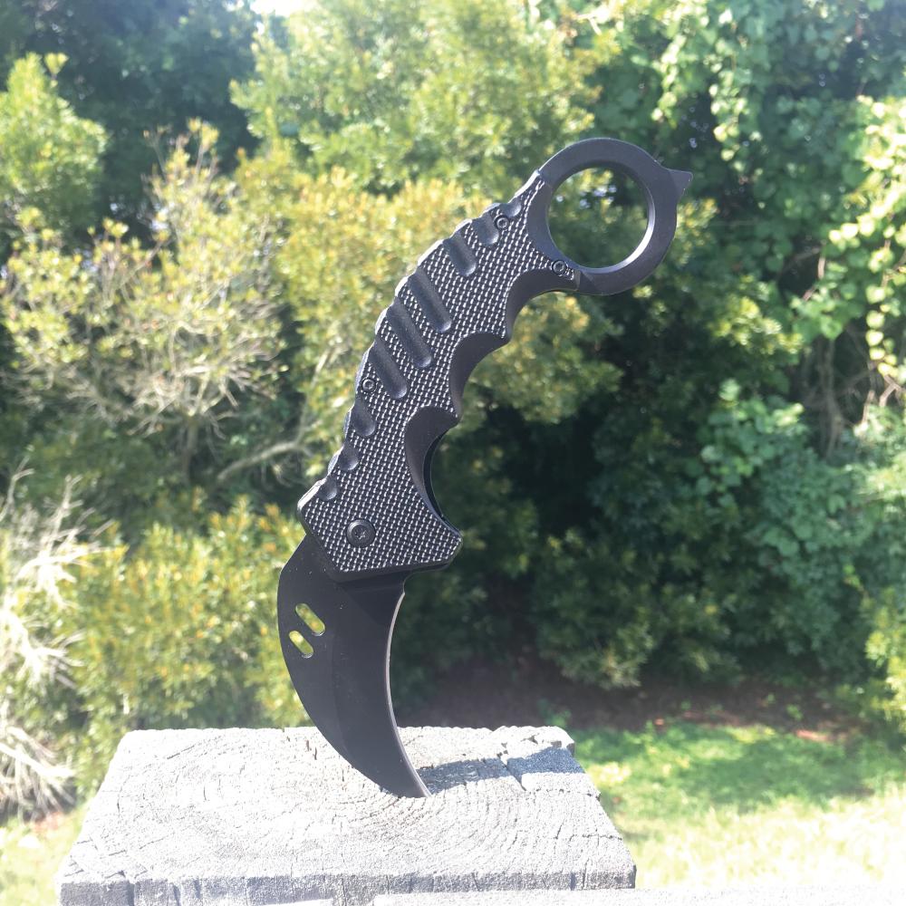 Karambit 5.25" Knife - curved blade folding knife designed for tactical use, featuring an ergonomic handle and a secure grip for self-defense.