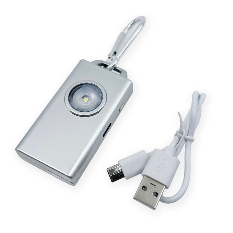 Micro Guard™ Plus Personal Alarm with COB LED Flashlight – compact personal safety device combining a 130 dB alarm and a COB LED floodlight, featuring a keychain loop and USB‑C rechargeable battery for everyday carry, in white background.
