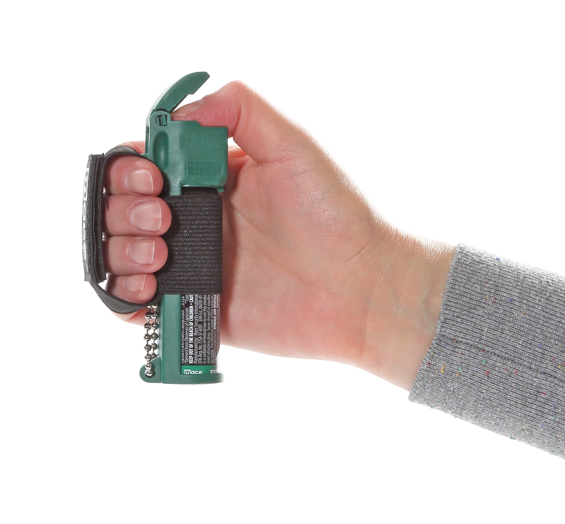 Someone holding Muzzle Dog Repellent Pepper Spray – compact, canine-safe pepper spray with a stream delivery system reaching up to 10 ft, flip-top safety cap, finger-grip design, keychain attachment, and adjustable strap for hands-free use during walks or jogging, in white background.