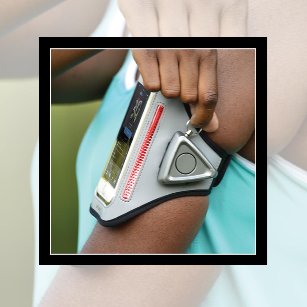 Someone wearing MYGUARD SPORT LED Armband & Safety Alarm w/Phone Holder - multifunctional wearable combining visibility, personal alarm, and phone storage for runners and outdoor activities.