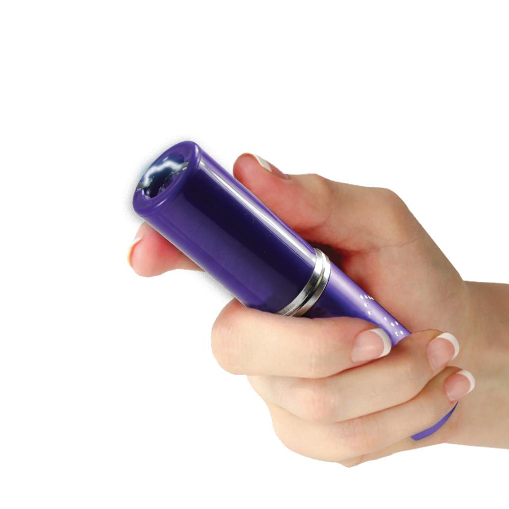 Someone holding Perfume Protector 17,000,000 Stun Gun - discreet self-defense tool in a perfume-style design with built-in safety switch, in white background.