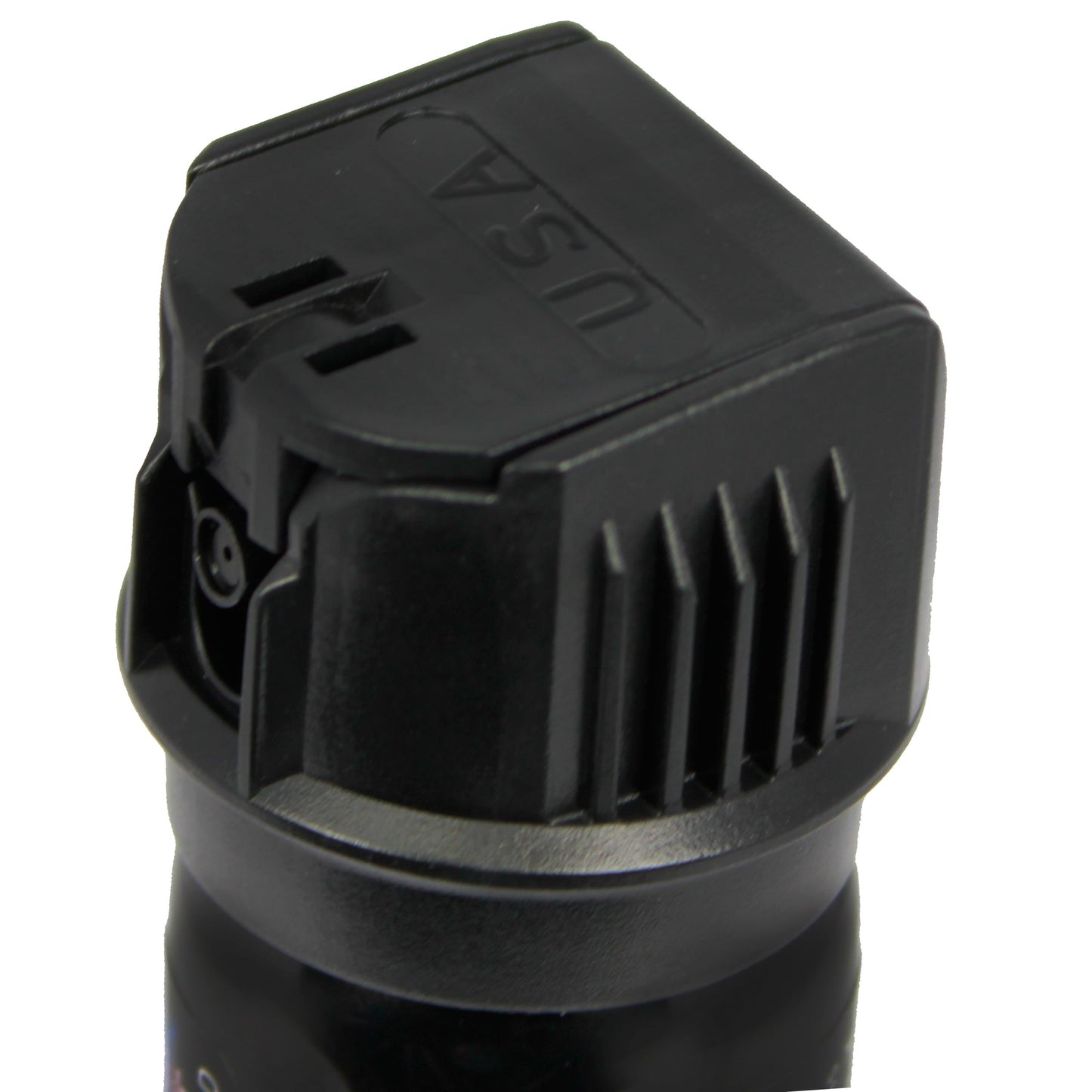 Close-up of Police Force 23 stream pepper spray with flip top safety cap - compact personal defense spray, on white background.