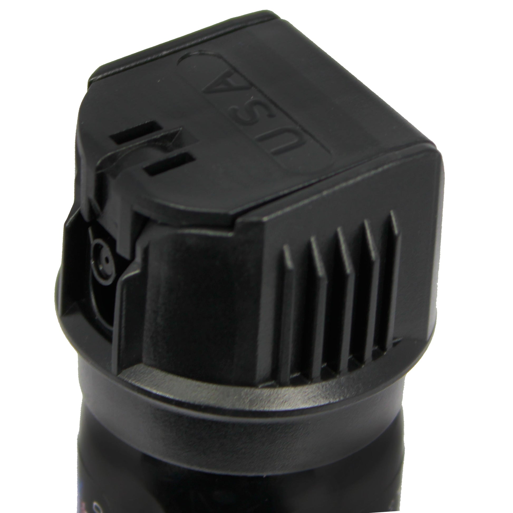 Close-up of Police Force 23 stream pepper spray with flip top safety cap - compact personal defense spray, on white background.