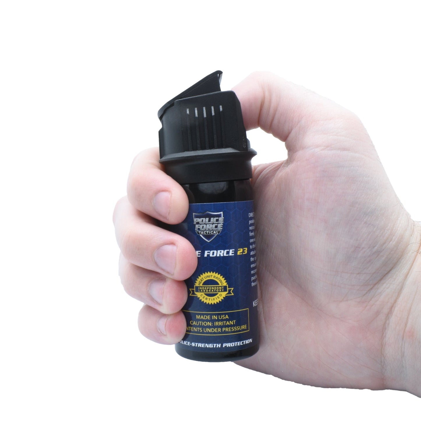 Someone holding Police Force 23 stream pepper spray with flip top safety cap - compact personal defense spray, on white background.