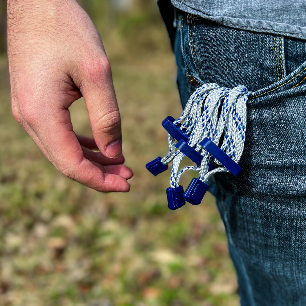 Someone carrying Single Use Quick Cuffs 10 Pack - disposable and durable restraining cuffs designed for law enforcement, security, and emergency use.