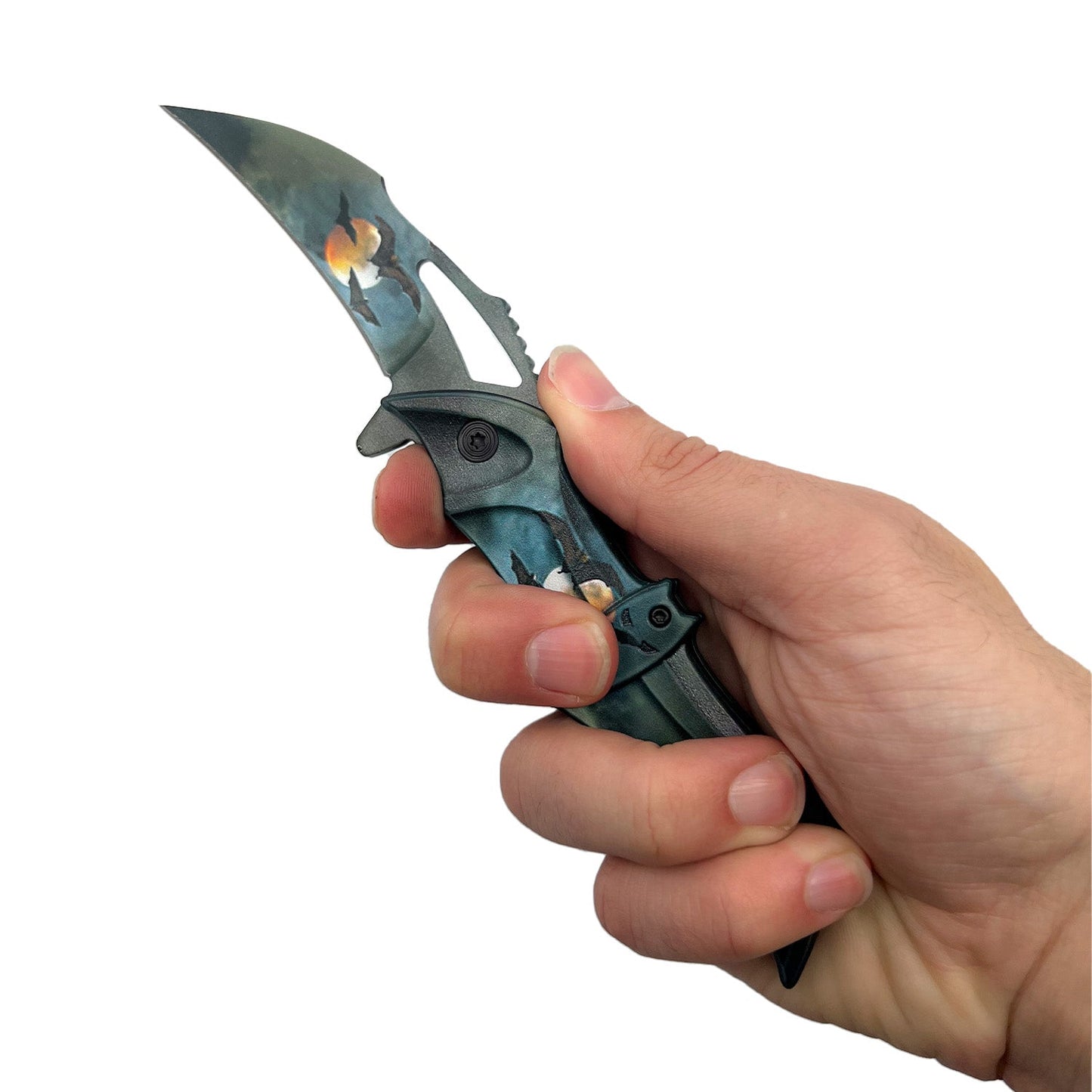 Someone holding Spring Assisted Bat Knife with ABS Handle – folding knife featuring a 3.75" black stainless steel blade, spring-assisted opening, and a 5" black bat-shaped ABS handle with pocket clip, in white background.