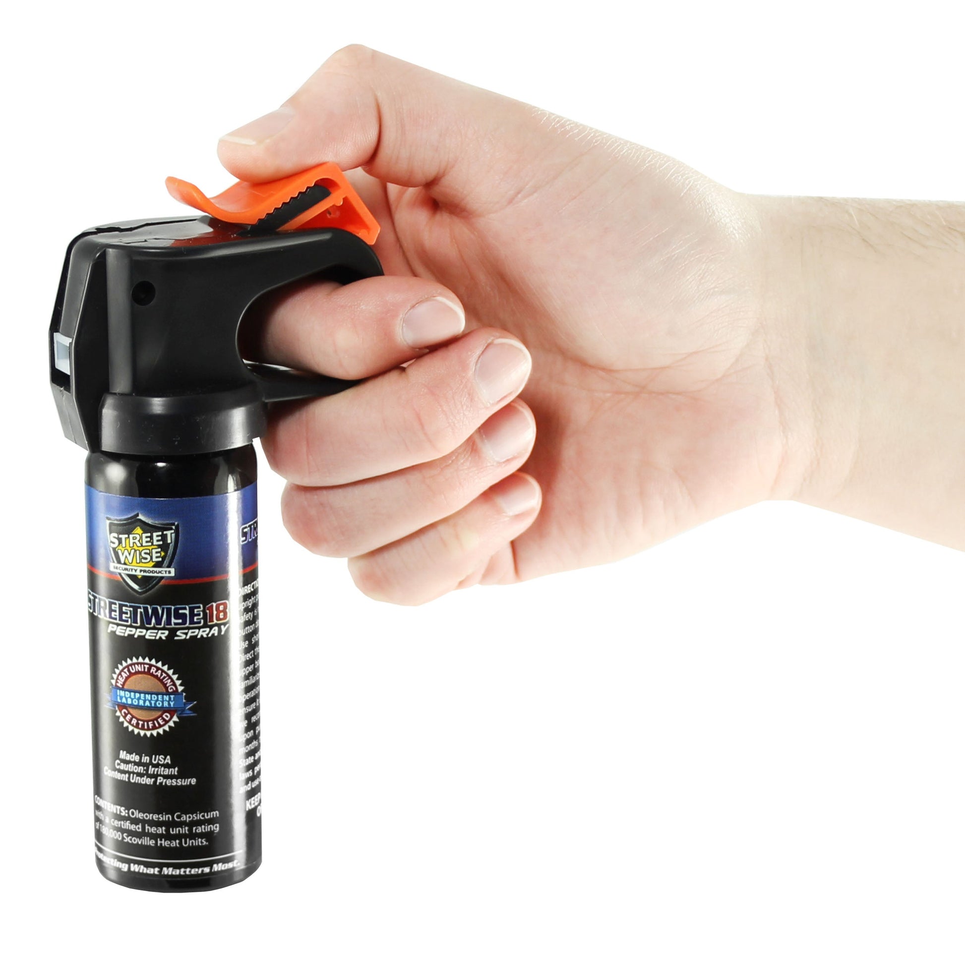 Close-up of someone holding a Streetwise 18 fogger pepper spray fire master placed on a white background.