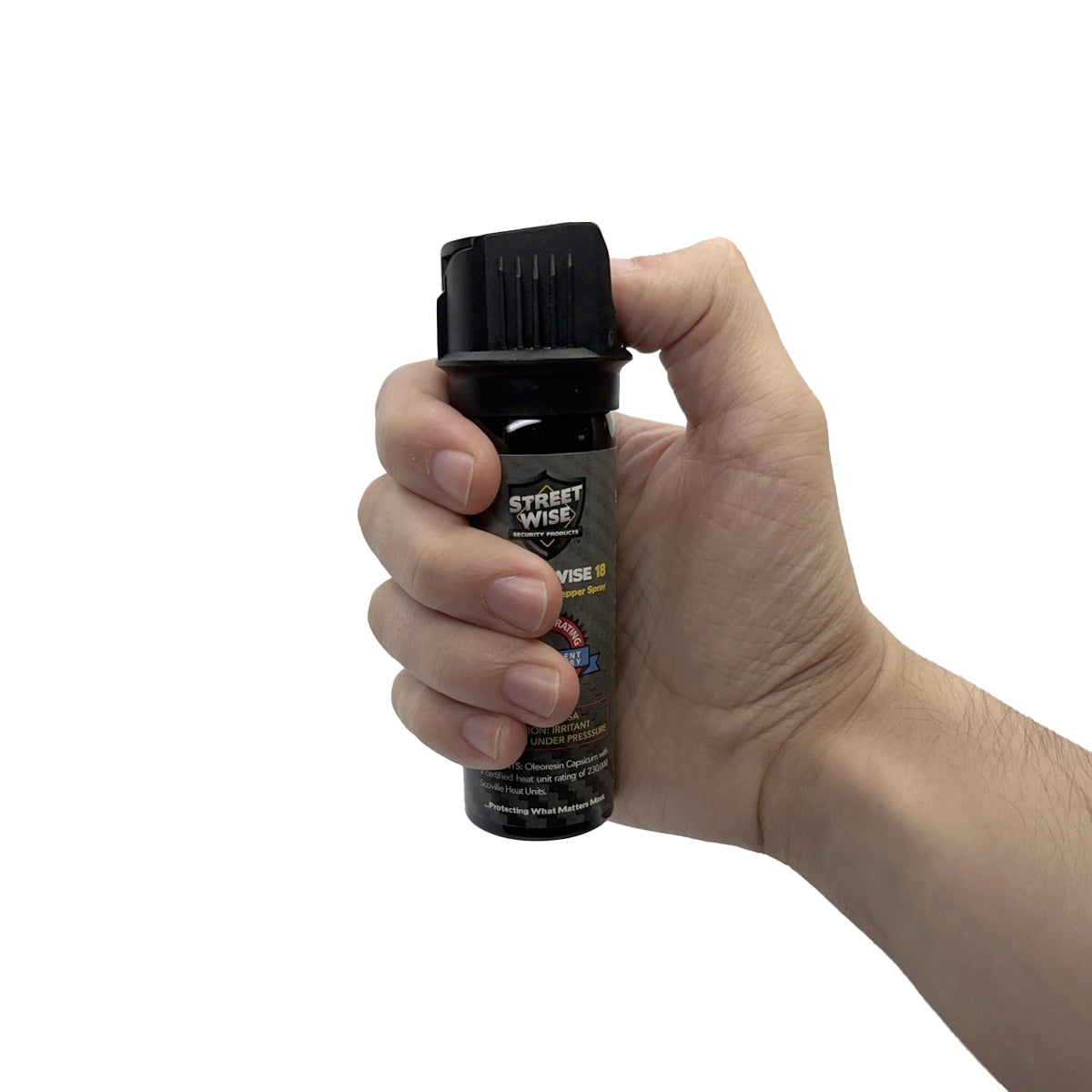 Someone holding Streetwise 18 pepper spray, 3oz flip-top design, effective personal defense tool, on a white background.