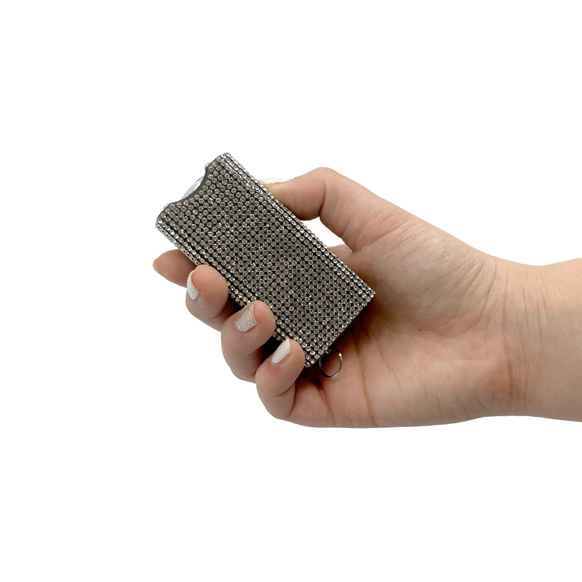 Someone holding Streetwise Rhinestun Keychain Stun Gun – compact mini stun gun with stylish rhinestone exterior, built-in LED flashlight, micro-USB rechargeable battery, dual-safety switch, keyring attachment, and nylon holster; delivers powerful high-voltage shock in a fashion-forward design, in white background.