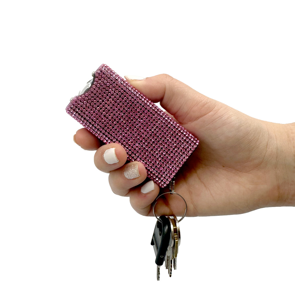 Someone holding Streetwise Rhinestun Keychain Stun Gun – compact mini stun gun with stylish rhinestone exterior, built-in LED flashlight, micro-USB rechargeable battery, dual-safety switch, keyring attachment, and nylon holster; delivers powerful high-voltage shock in a fashion-forward design, with keys, in white background.