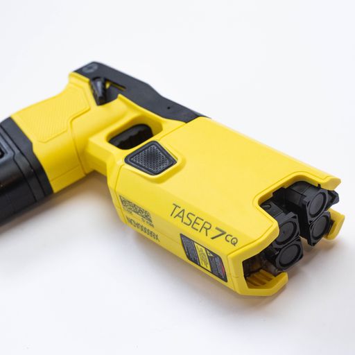 Taser 7 CQ - close-quarters conducted energy weapon designed for law enforcement and personal defense, providing effective stopping power at short range, in white background.