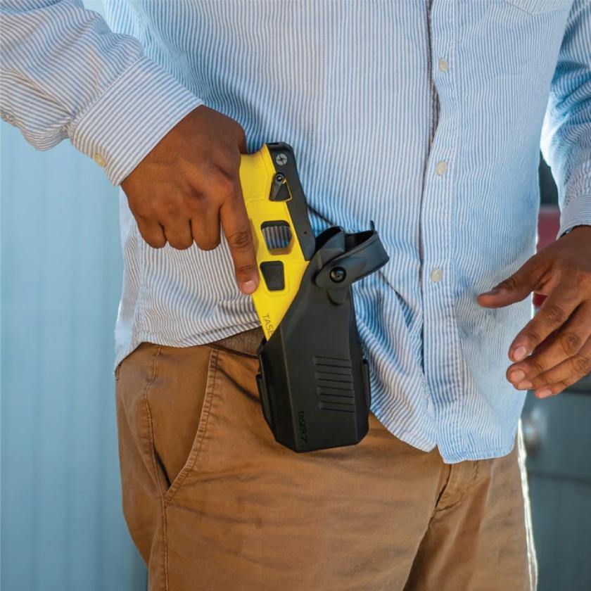 Someone carrying Taser 7 CQ - close-quarters conducted energy weapon designed for law enforcement and personal defense, providing effective stopping power at short range.