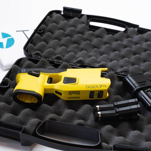 Taser 7 CQ on case - close-quarters conducted energy weapon designed for law enforcement and personal defense, providing effective stopping power at short range, in white background.